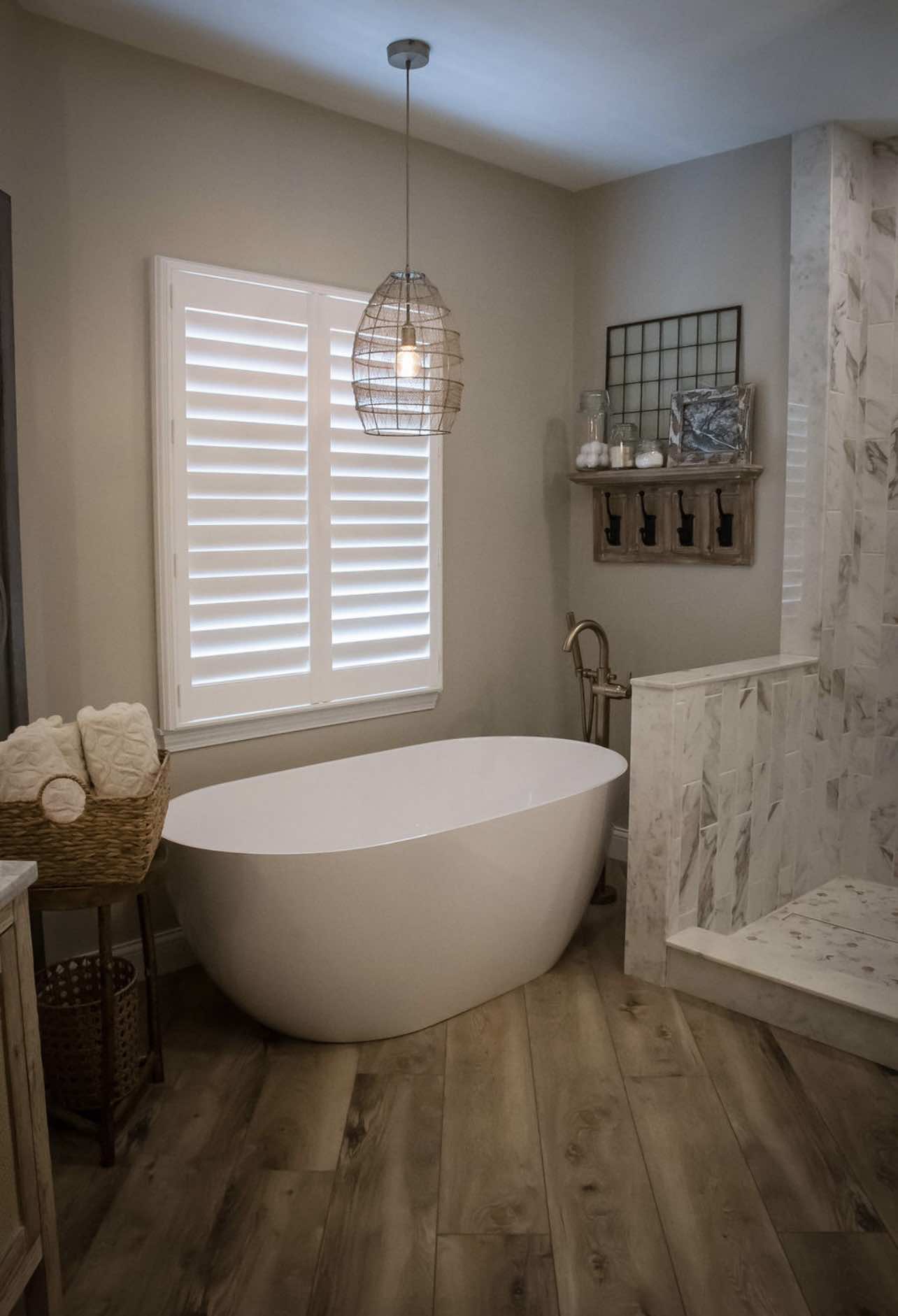 Completed Timberline bath with freestanding tub and marble finishes